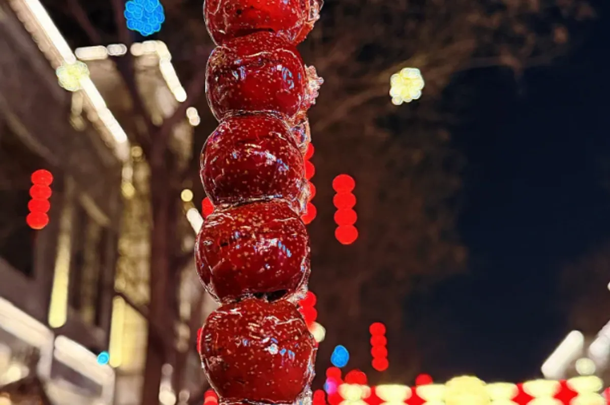 Tanghulu — skewered hawthorn berries coated in a crisp glassy sugar shell